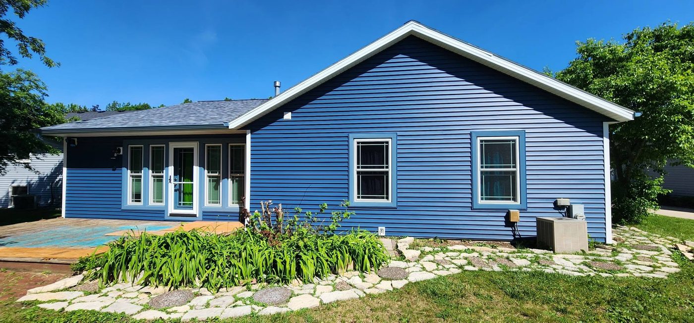 Same home with fresh blue siding after Ironhorse Exteriors